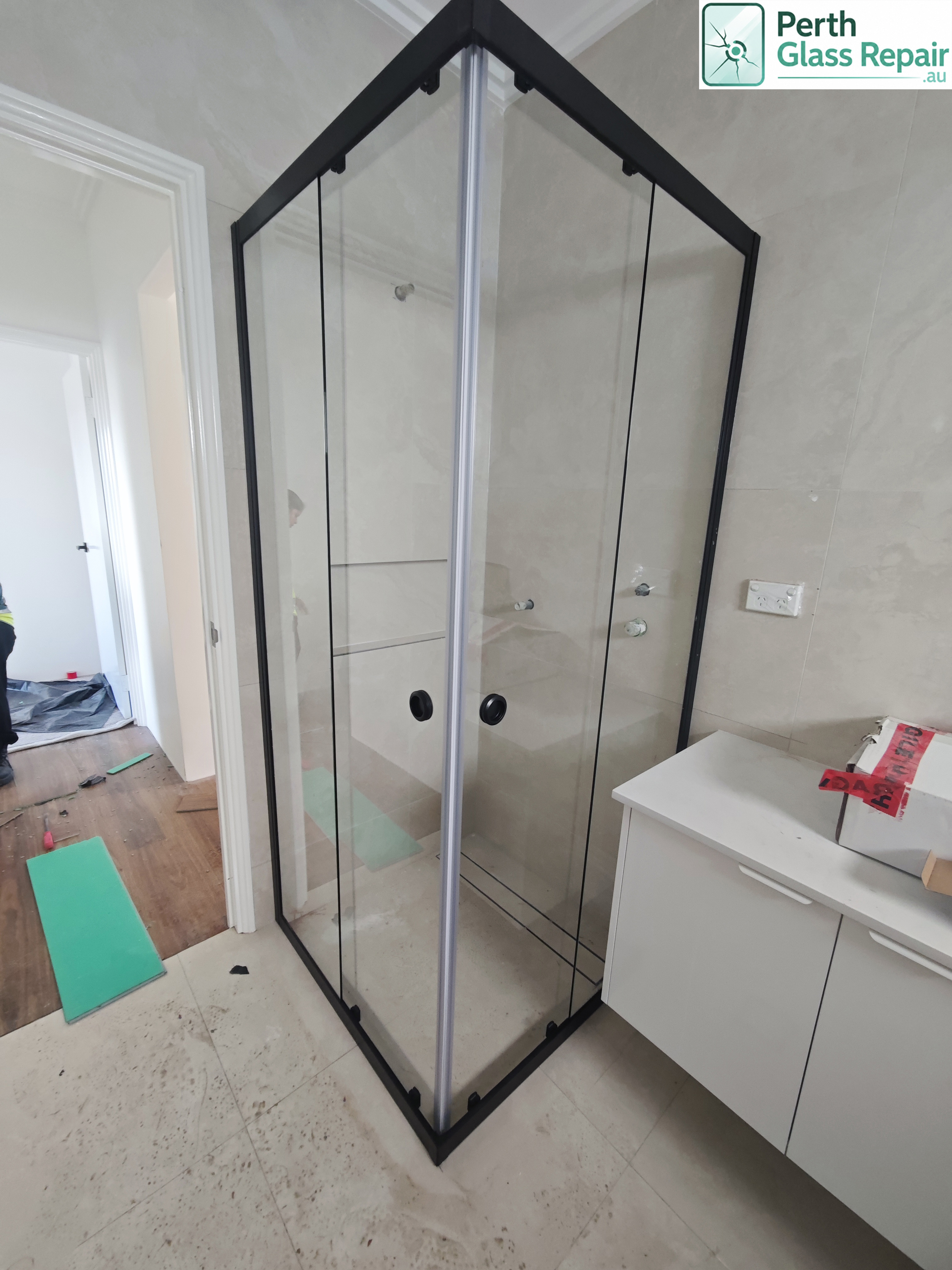 Black-framed corner shower screen installed by Perth Glass Repair